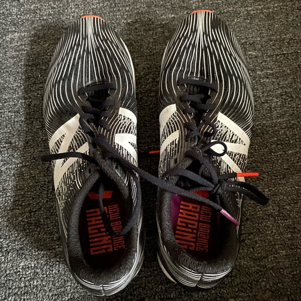 Size: 7.5 New Balance racing flats (black, purple and orange)